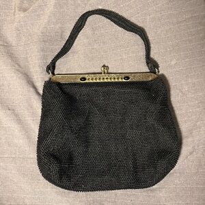 Black beaded handbag with bejeweled gold rim